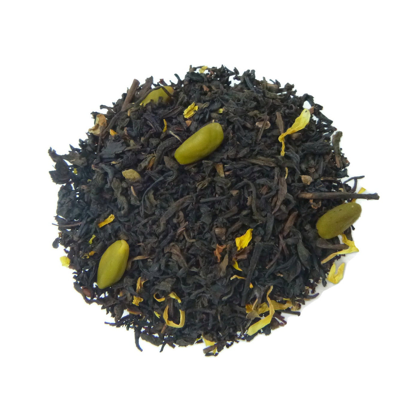 Tea leaves with green pistachio nuts on a white background