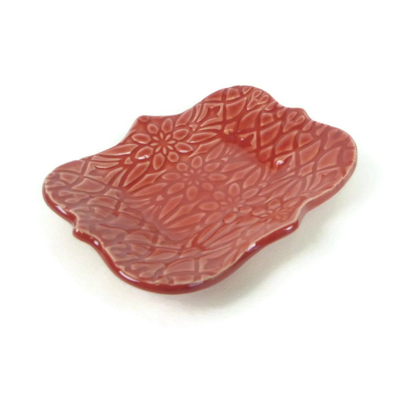 Large Red Scalloped Trivet with Geofloral Texture